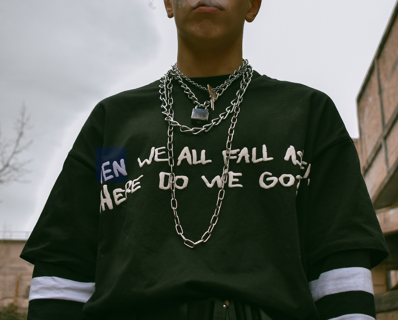 A person in Brooklyn wearing a stylish Teddy Howler Jewelry piece, showcasing the brand's unique, handcrafted design. The jewelry adds a touch of elegance and urban flair, reflecting Brooklyn's artistic spirit.